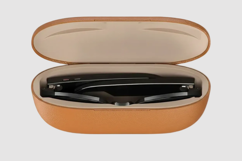An open portable magnetic charging case containing the AI Smart Glasses, designed for secure storage and on-the-go power