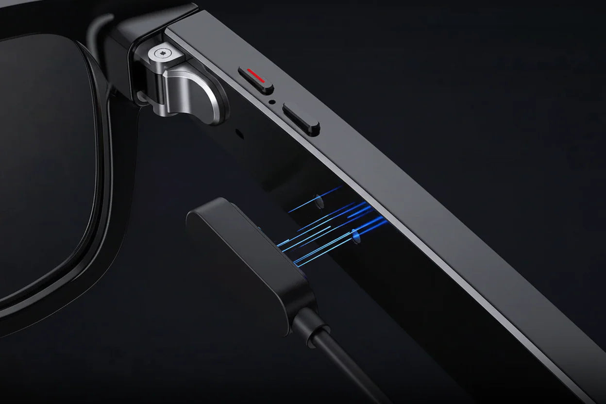 Inside close-up of AI Smart Glasses showing the strong and durable metal hinges, video and photo capture buttons and illustration of magnetic charger joining with the charging port