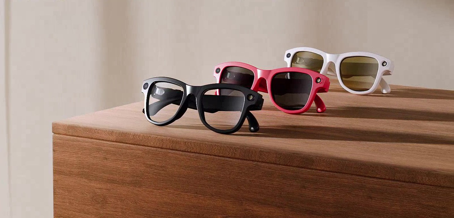 Three variants of the AI Smart Glasses displayed in black, beige and red frame options